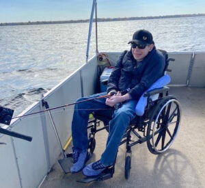 Mike Theobald fishing onboard a pontoon boat on Oneida Lake.