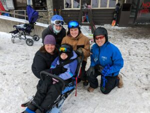 This is the Daly family. Father, Pete, is ARISE & Ski Ed Staff. Morgan is the participant with Brother, Alex and Sister, Madison as her Volunteers.